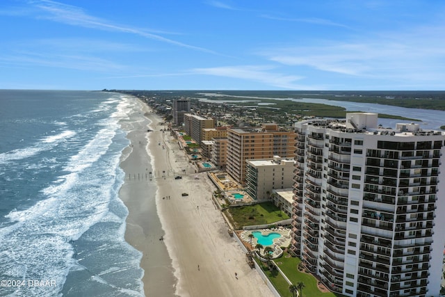 birds eye view of property featuring a water view, a city view, and a view of the beach