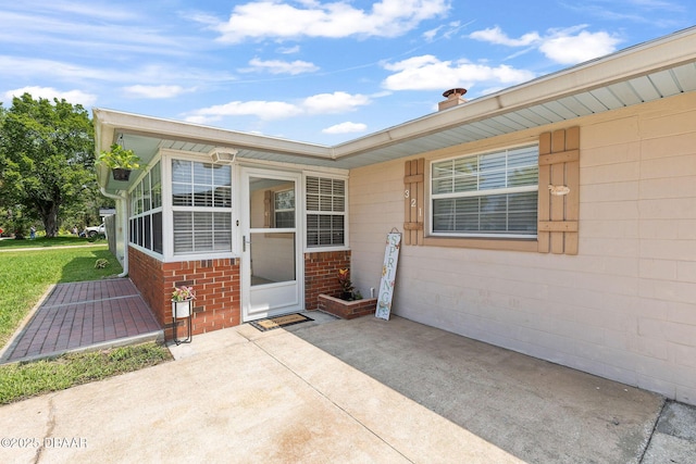 321 Scotland Dr, Holly Hill, FL 32117 - entrance to property featuring a patio and brick siding