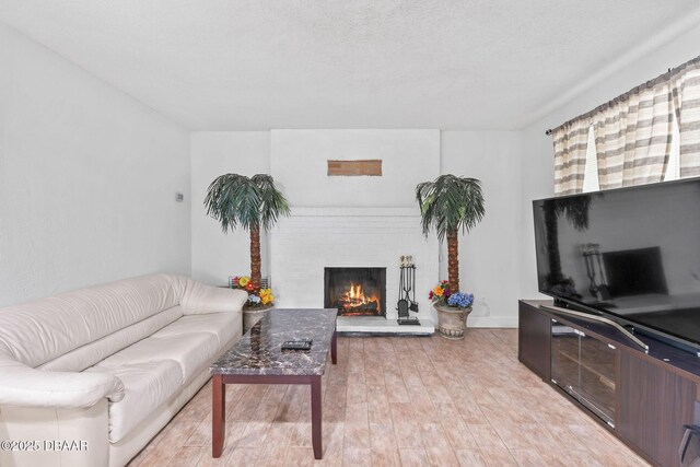 321 Scotland Dr, Holly Hill, FL 32117 - living area with light wood-style floors, a fireplace, and baseboards