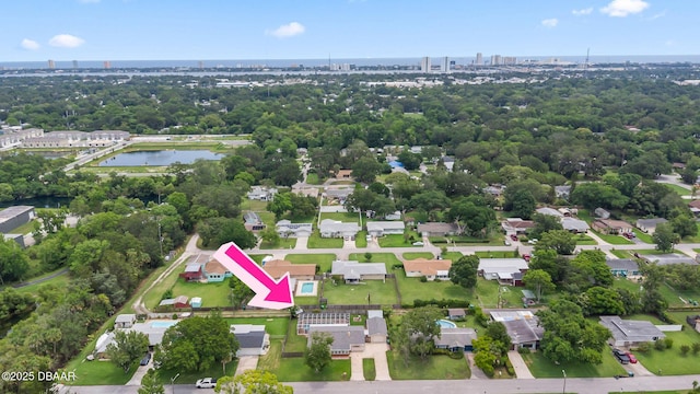 321 Scotland Dr, Holly Hill, FL 32117 - aerial view of property and surrounding area with a large body of water, nearby urban area, and a tree filled landscape