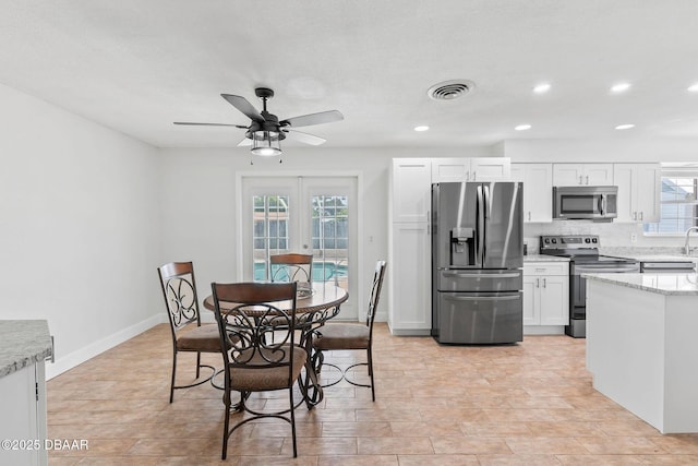 321 Scotland Dr, Holly Hill, FL 32117 - dining space featuring a ceiling fan, recessed lighting, and baseboards