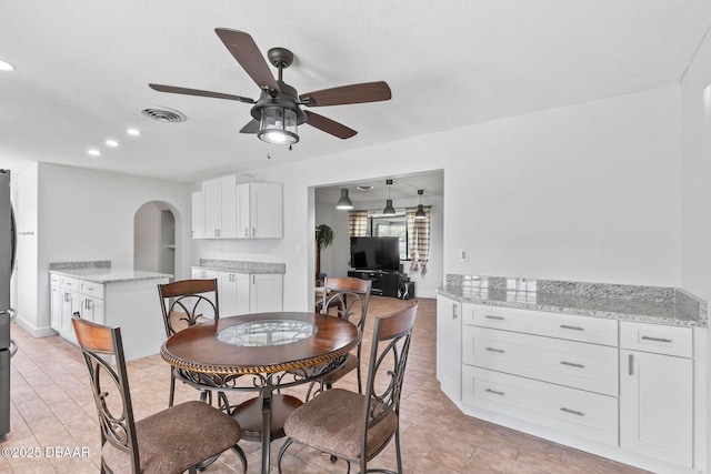 321 Scotland Dr, Holly Hill, FL 32117 - dining room with a ceiling fan, arched walkways, and recessed lighting