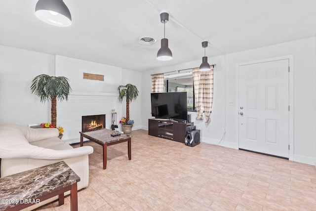 321 Scotland Dr, Holly Hill, FL 32117 - living area featuring a fireplace and baseboards