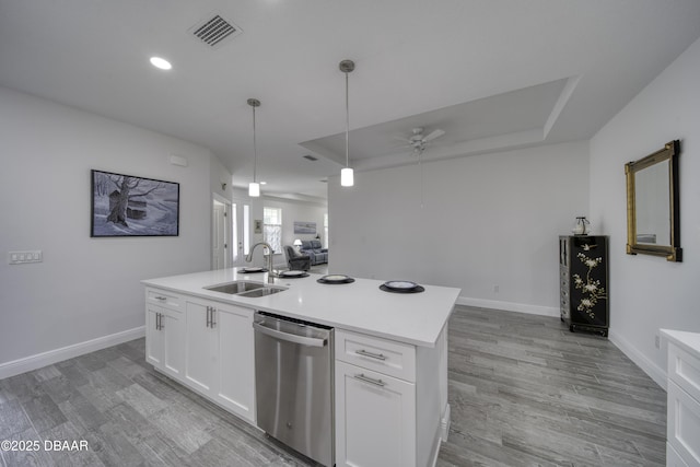 kitchen with ceiling fan, a sink, dishwasher, light countertops, and visible vents