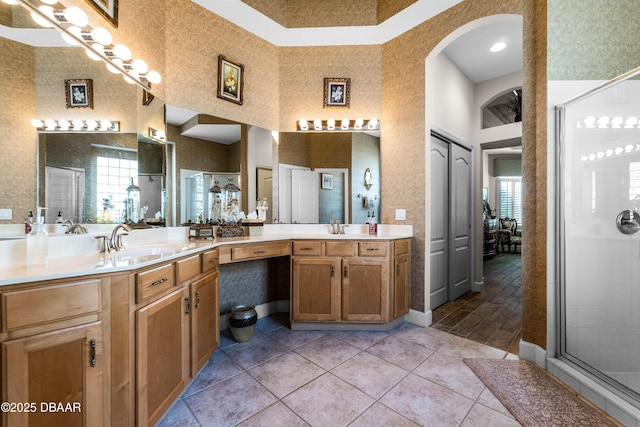 4 Arika At Lionspaw, Daytona Beach, FL 32124 - full bathroom with a high ceiling, vanity, a stall shower, and tile patterned floors
