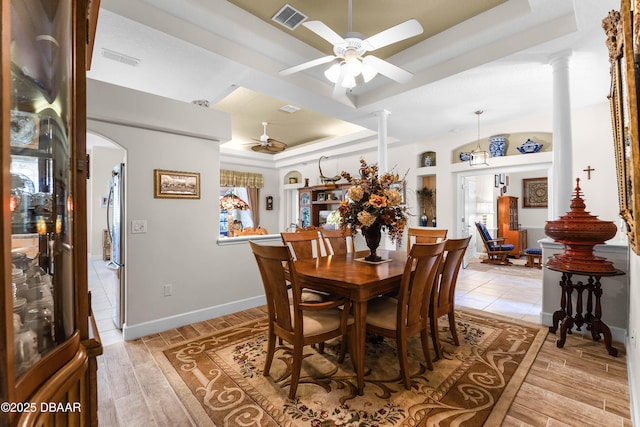 4 Arika At Lionspaw, Daytona Beach, FL 32124 - dining room with a raised ceiling, decorative columns, ceiling fan, and light wood finished floors