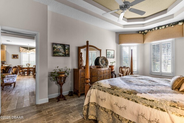 4 Arika At Lionspaw, Daytona Beach, FL 32124 - bedroom with wood finished floors, a raised ceiling, and ceiling fan