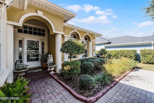 4 Arika At Lionspaw, Daytona Beach, FL 32124 - doorway to property featuring stucco siding and a patio area