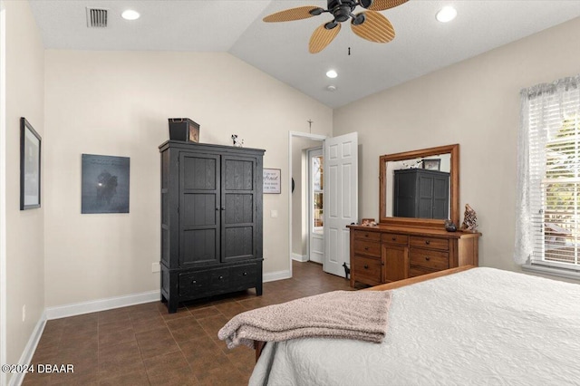 tiled bedroom with vaulted ceiling and ceiling fan