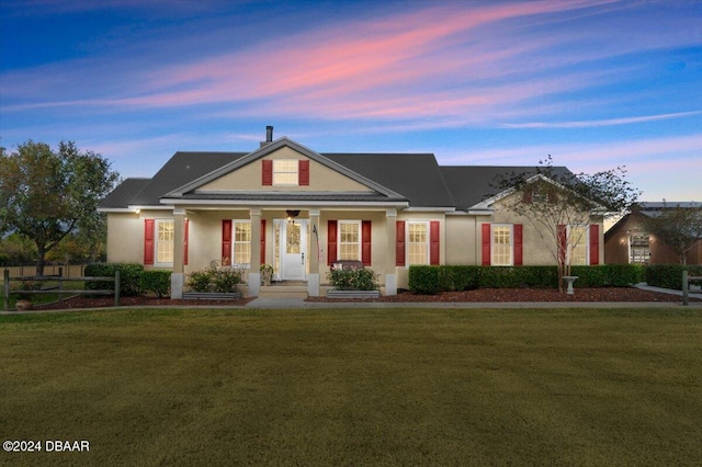 view of front of house with a yard