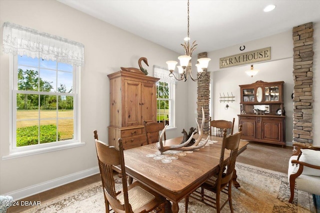 dining area with plenty of natural light and a chandelier