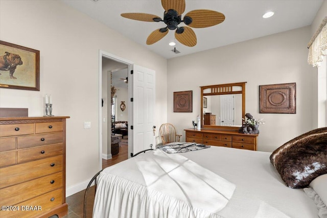 tiled bedroom with ceiling fan