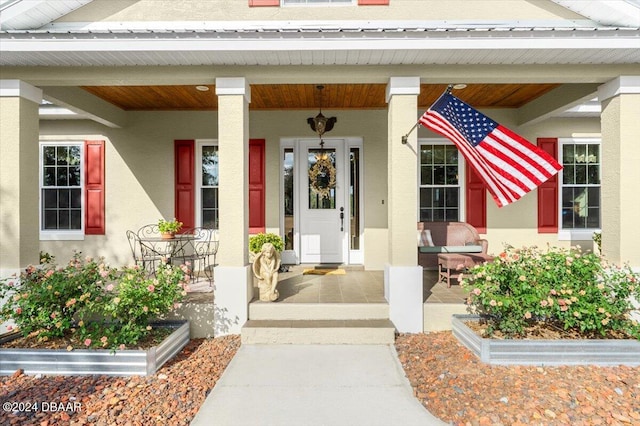 doorway to property with covered porch