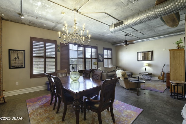 dining area featuring visible vents, baseboards, concrete floors, and ceiling fan with notable chandelier