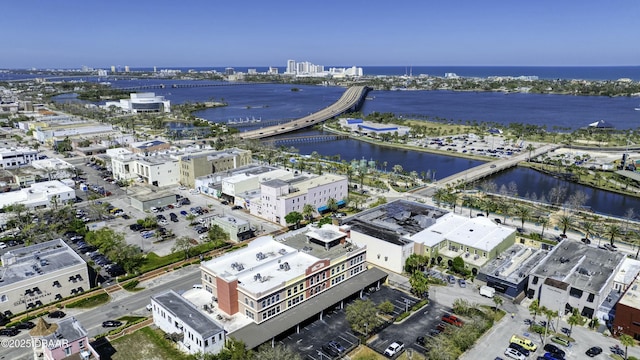 drone / aerial view featuring a water view and a city view