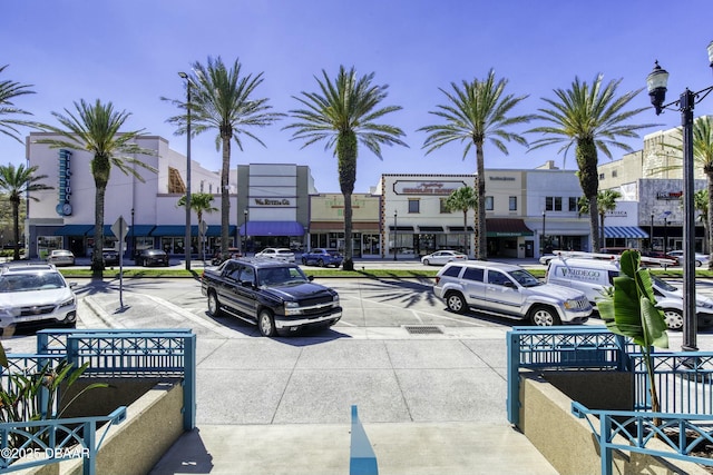 exterior space featuring curbs and street lights