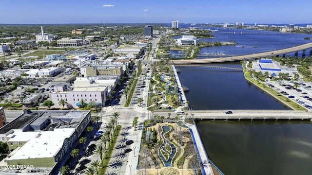 birds eye view of property with a city view and a water view