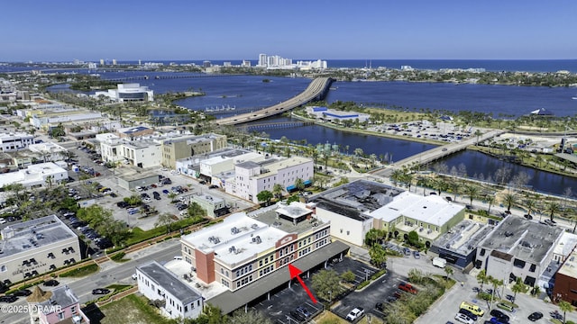 bird's eye view featuring a view of city and a water view