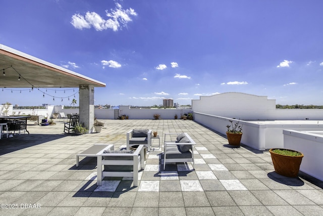 view of patio with an outdoor living space and fence