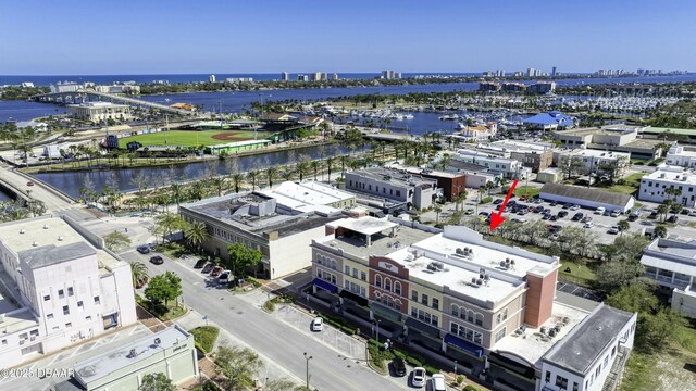 aerial view with a city view and a water view