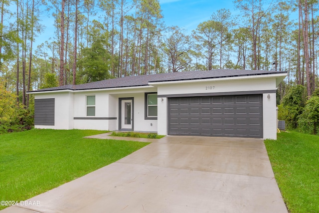 single story home with a garage, cooling unit, and a front lawn