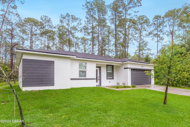 ranch-style home with a garage and a front yard