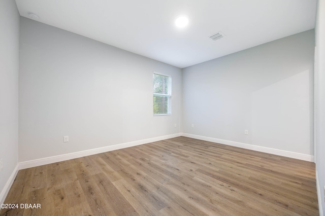 empty room with light hardwood / wood-style floors