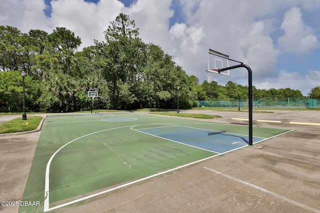 18 Landings Ln, Ormond Beach, FL 32174 - view of basketball court with community basketball court and view of wooded area