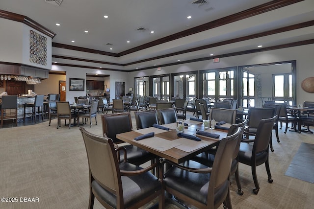 18 Landings Ln, Ormond Beach, FL 32174 - dining room with ornamental molding, light carpet, recessed lighting, and a raised ceiling