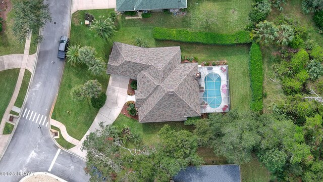 ranch-style house with a garage and a front yard