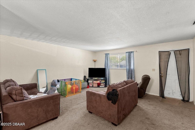 living area with visible vents, a textured ceiling, and light colored carpet