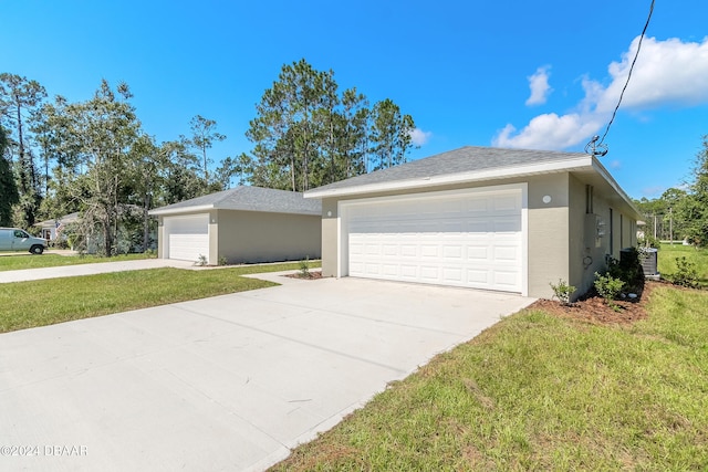 view of front facade featuring a garage and a front lawn