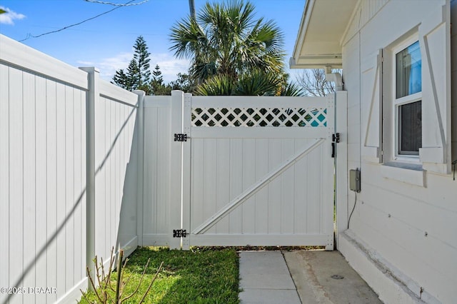 view of gate with fence