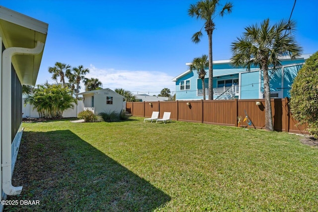 view of yard with a fenced backyard