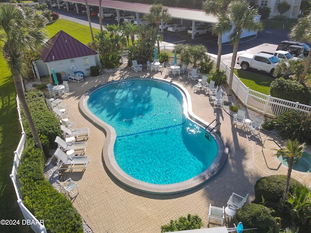 view of swimming pool featuring a patio area