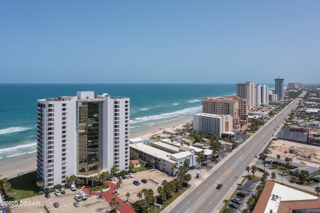 aerial view with a water view and a view of the beach