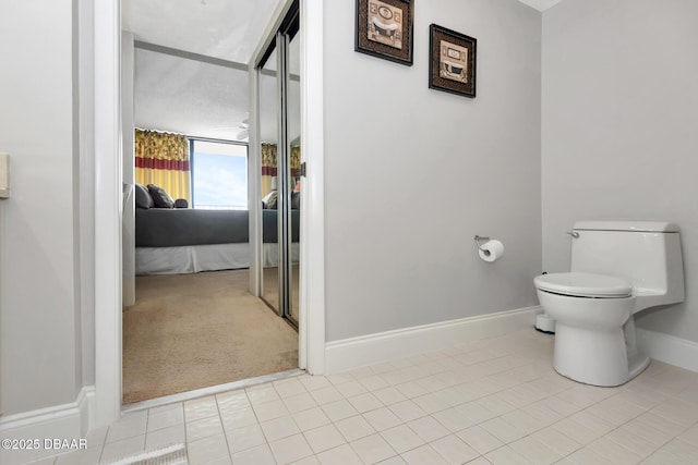 bathroom featuring tile patterned floors and toilet