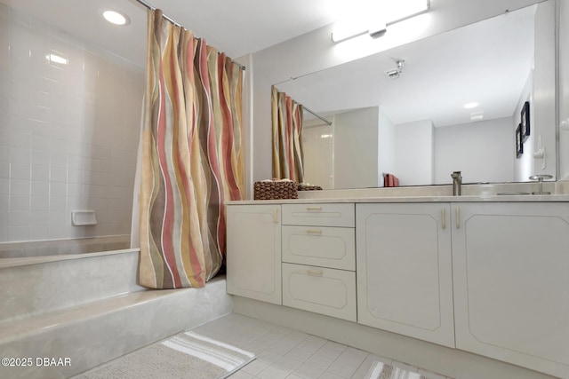 bathroom featuring tile patterned flooring, shower / tub combo, and vanity