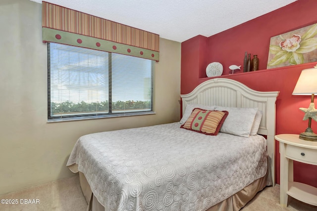 carpeted bedroom featuring a textured ceiling