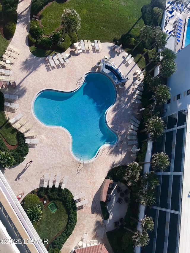 view of pool with a jacuzzi