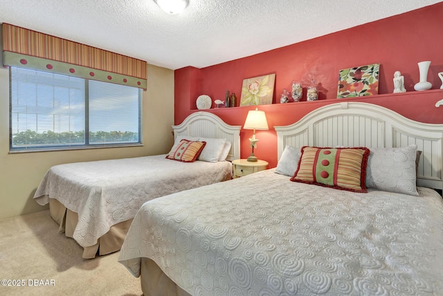 bedroom featuring carpet and a textured ceiling