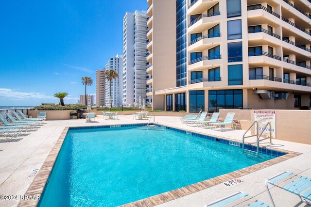 3023 S Atlantic Ave Unit 7070, Daytona Beach, FL 32118 - community pool featuring a patio area