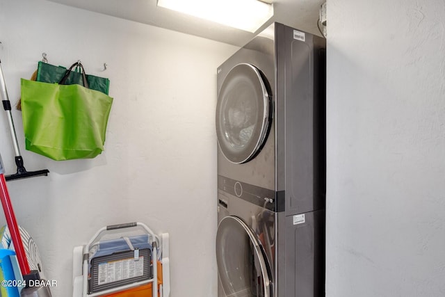 laundry area featuring stacked washer and clothes dryer