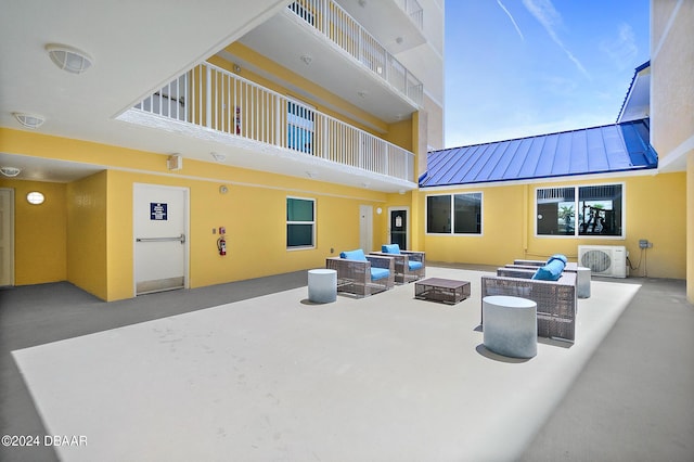 view of patio / terrace featuring ac unit and an outdoor hangout area