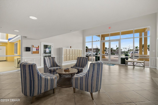 interior space featuring mail boxes and light tile patterned flooring