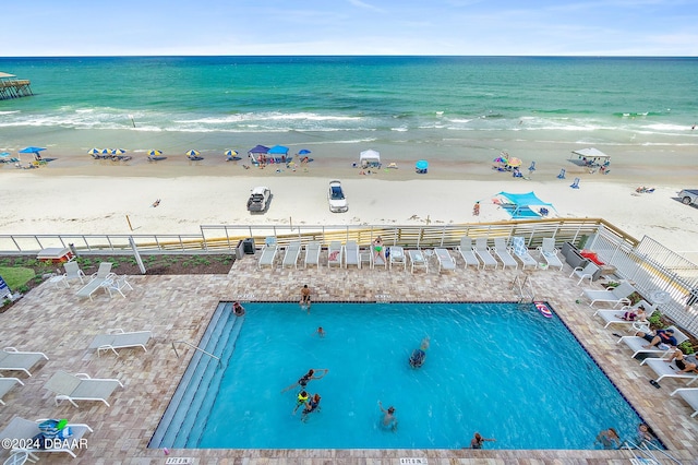 birds eye view of property with a view of the beach and a water view