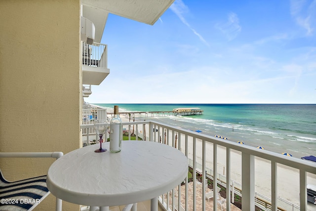 balcony with a view of the beach and a water view