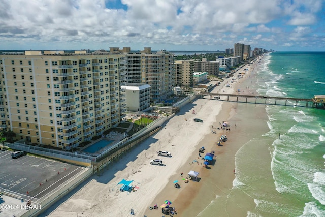 aerial view featuring a water view and a beach view