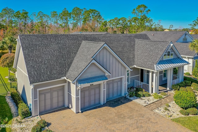 view of front of house featuring a garage and a porch