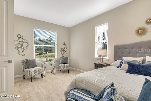 bedroom with light hardwood / wood-style flooring